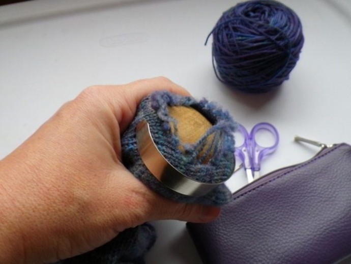 Using a darning mushroom to weave in ends