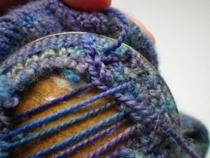 Using a darning mushroom to weave in ends