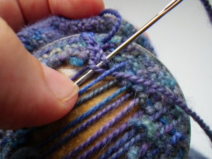 Using a darning mushroom to weave in ends